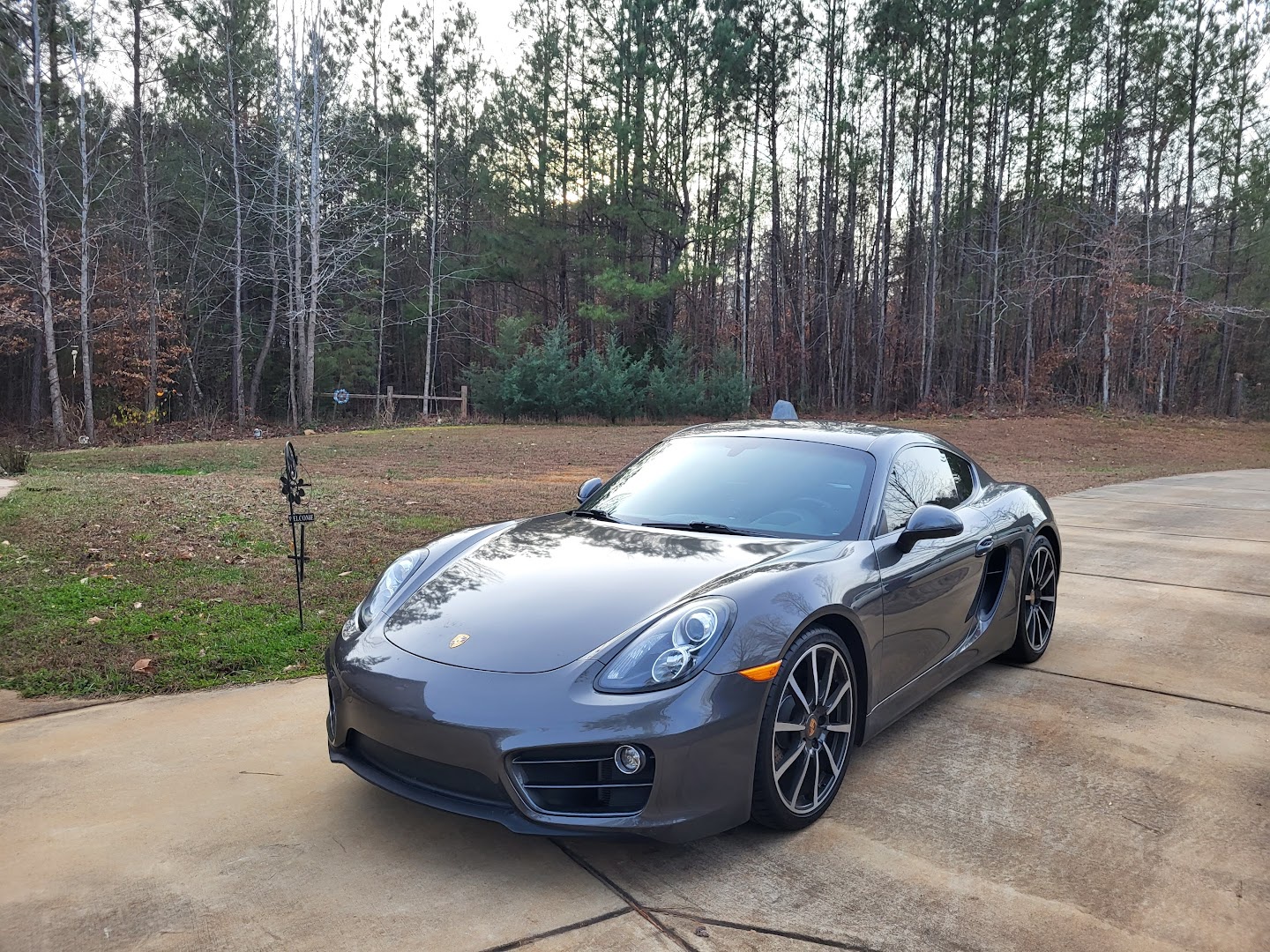 Gray Porsche Cayman parked outdoors