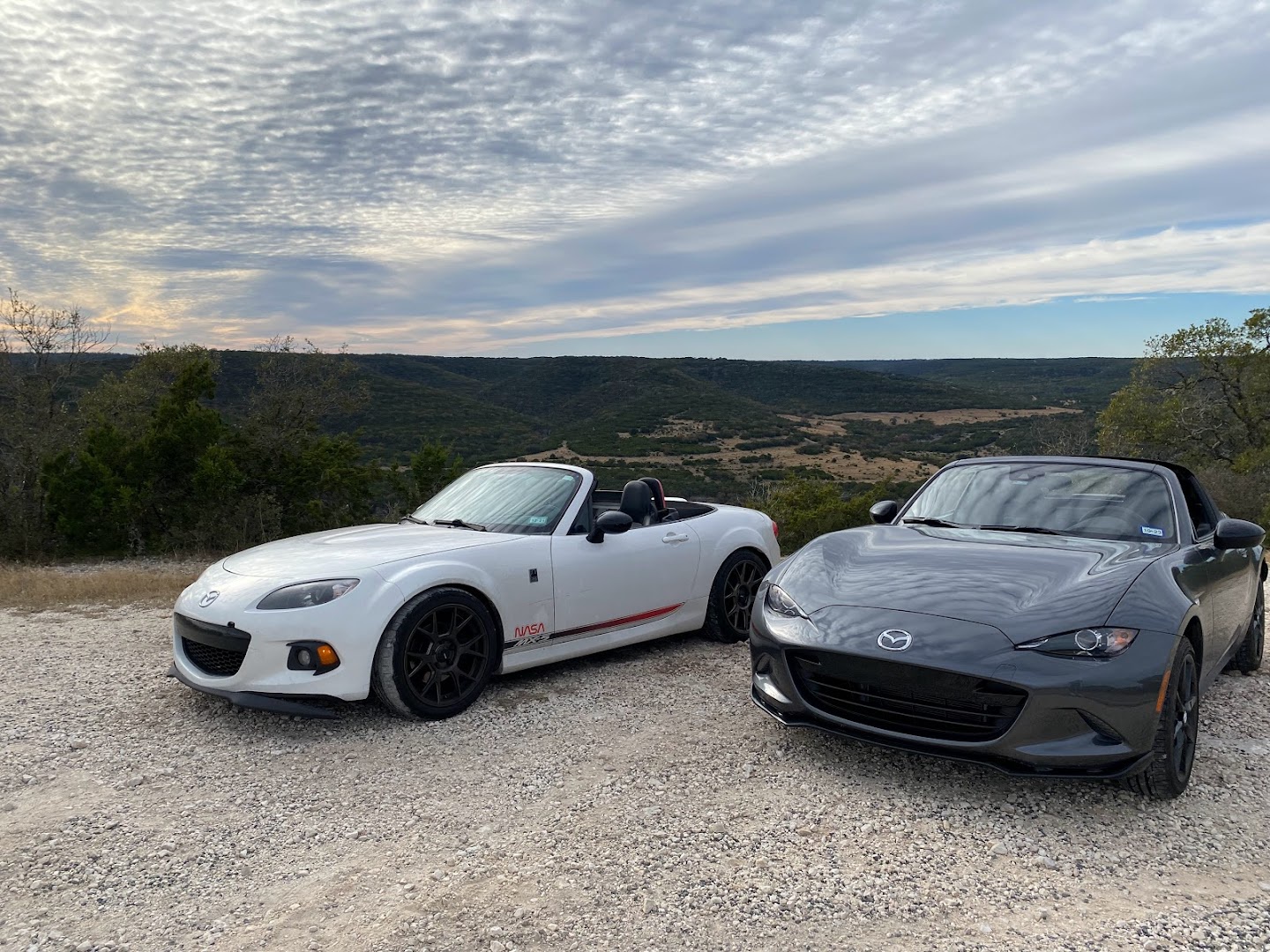 Two Mazda MX-5 Miatas parked side by side